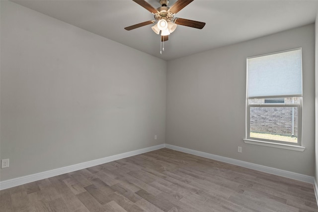 empty room featuring ceiling fan and light hardwood / wood-style floors