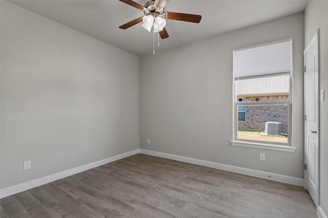 empty room featuring ceiling fan and light hardwood / wood-style flooring