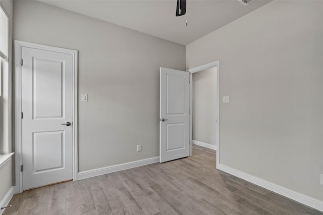 unfurnished bedroom featuring light hardwood / wood-style floors and ceiling fan