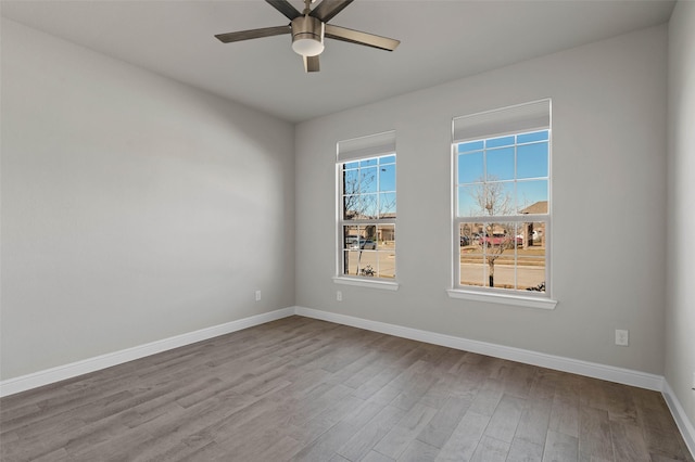 spare room featuring ceiling fan and light wood-type flooring