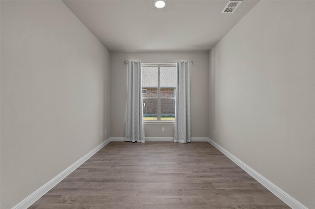 empty room with light hardwood / wood-style floors