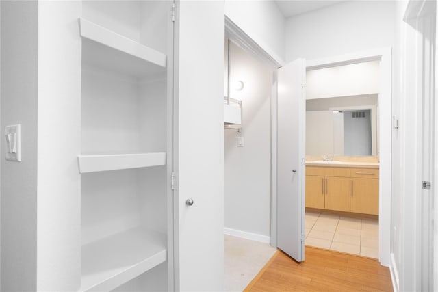 bathroom featuring hardwood / wood-style floors and vanity