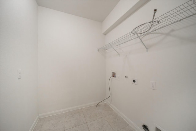 laundry room with light tile patterned flooring, washer hookup, gas dryer hookup, and electric dryer hookup