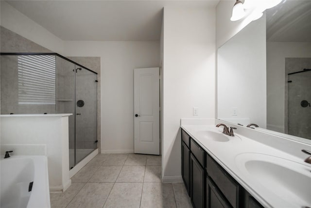 bathroom with vanity, tile patterned flooring, and shower with separate bathtub