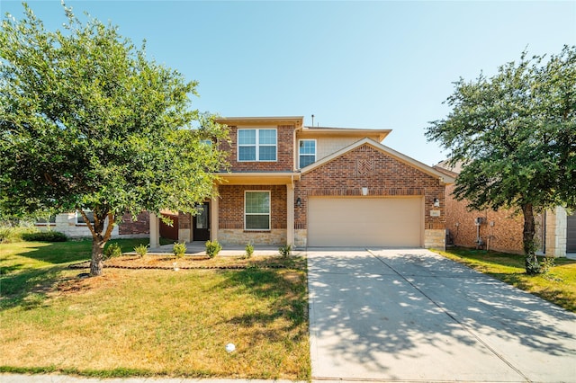 view of front of property featuring a garage and a front yard