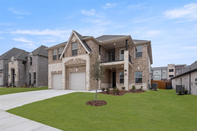 view of front of property featuring cooling unit, a garage, a front yard, and a balcony