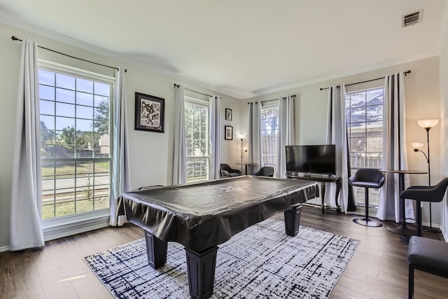 playroom with wood-type flooring, ornamental molding, and pool table