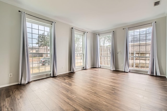 empty room with light hardwood / wood-style flooring