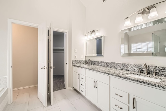 bathroom with vanity and tile patterned flooring