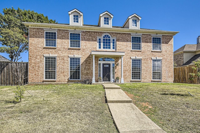 view of front of property with a front lawn