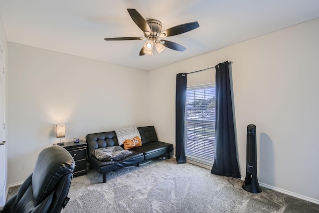 living area featuring ceiling fan and carpet floors