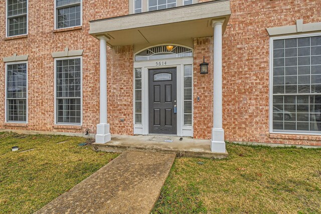 colonial house featuring a front yard and central air condition unit