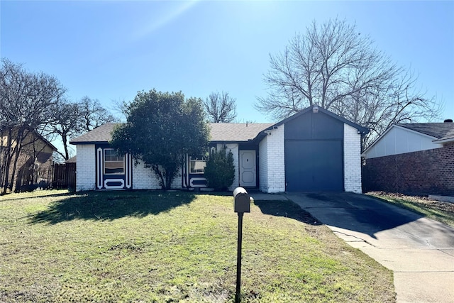 ranch-style house with a garage and a front lawn