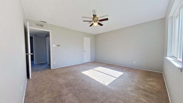 unfurnished bedroom featuring carpet and ceiling fan