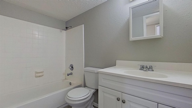 full bathroom with a textured ceiling, vanity, shower / bathtub combination, and toilet