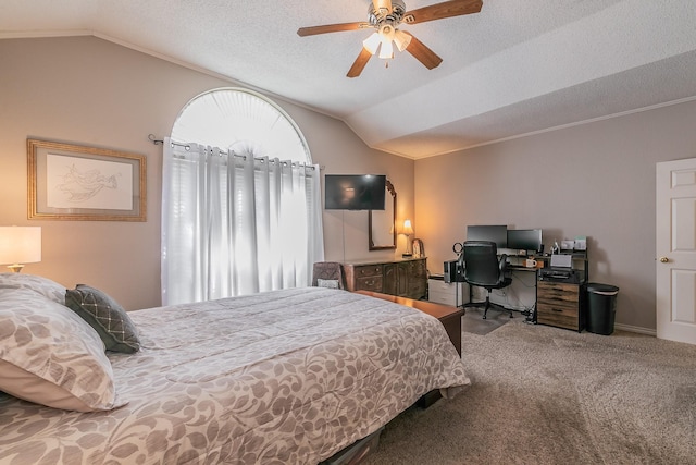 carpeted bedroom featuring a textured ceiling, ceiling fan, crown molding, and vaulted ceiling