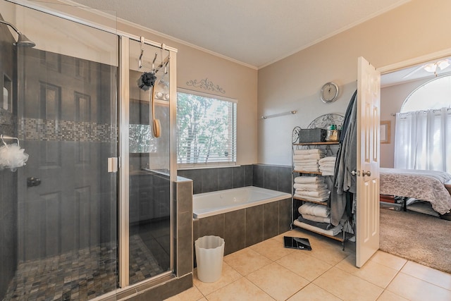 bathroom featuring tile patterned flooring, independent shower and bath, and ornamental molding