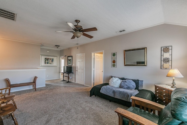 carpeted living room with a textured ceiling, ceiling fan, and lofted ceiling