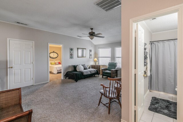 carpeted living room with ceiling fan and a textured ceiling