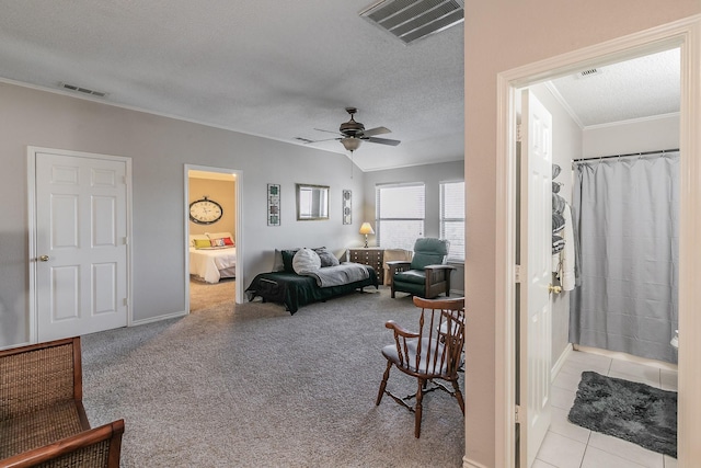 tiled living room featuring crown molding, ceiling fan, and a textured ceiling