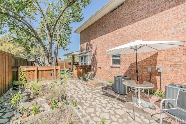 view of patio with central AC