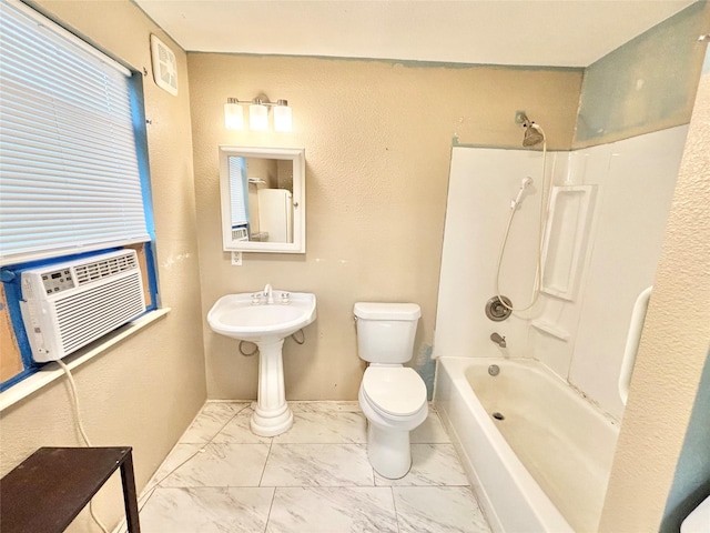 bathroom with bathing tub / shower combination, cooling unit, and toilet