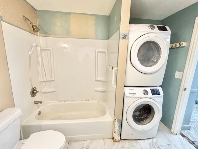 washroom with stacked washer and clothes dryer