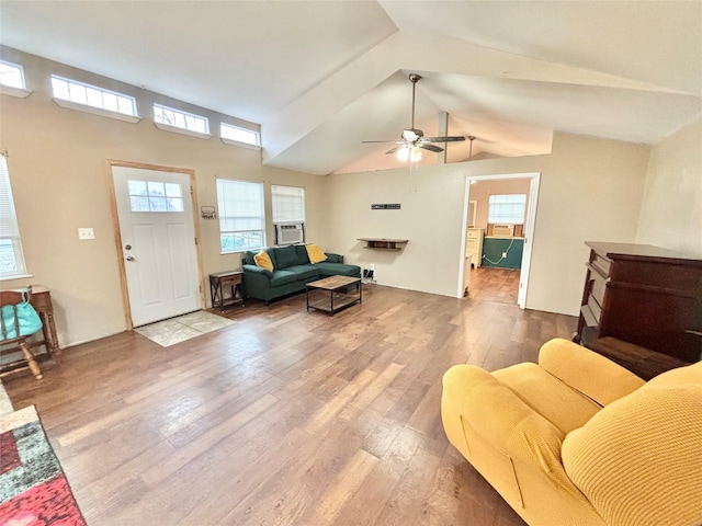 living room featuring ceiling fan, cooling unit, vaulted ceiling, and hardwood / wood-style flooring