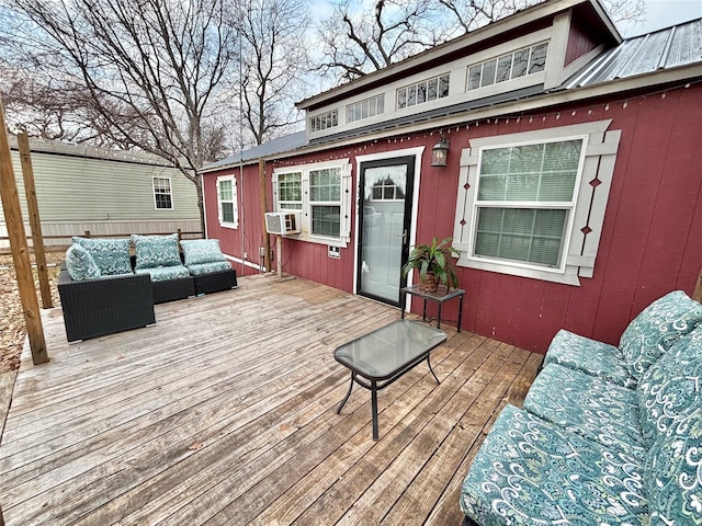 wooden deck featuring outdoor lounge area and cooling unit