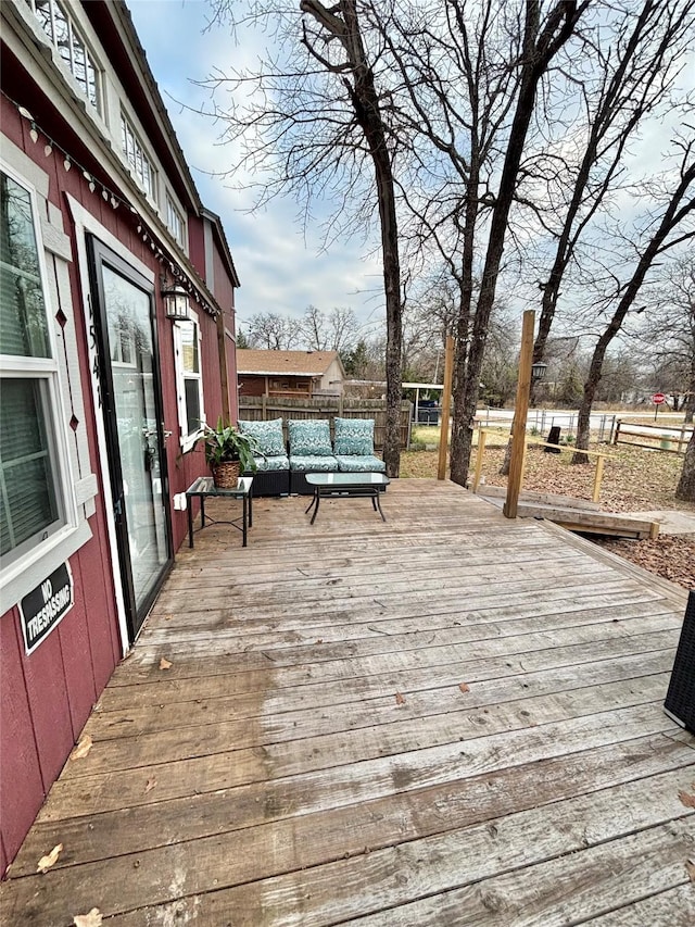 wooden deck featuring outdoor lounge area