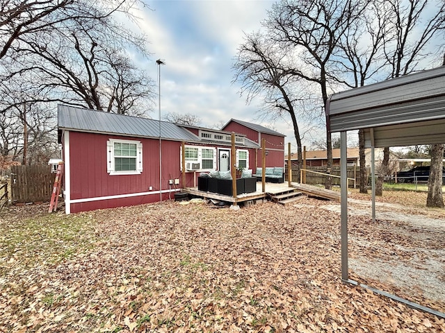 back of house featuring a deck