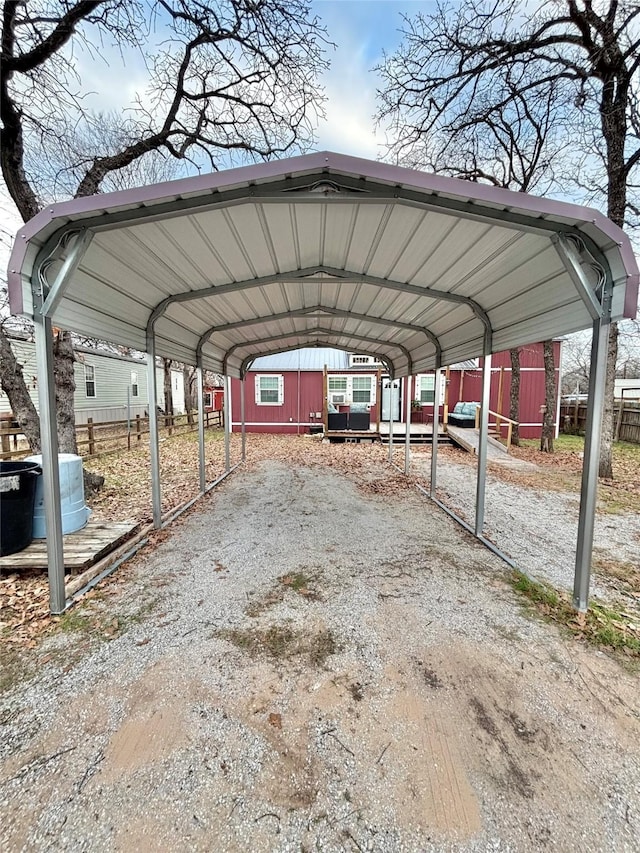 view of vehicle parking with a carport