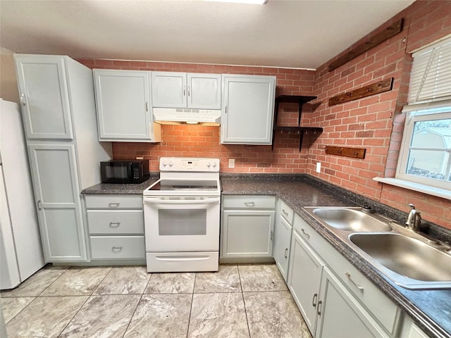 kitchen featuring sink and white appliances