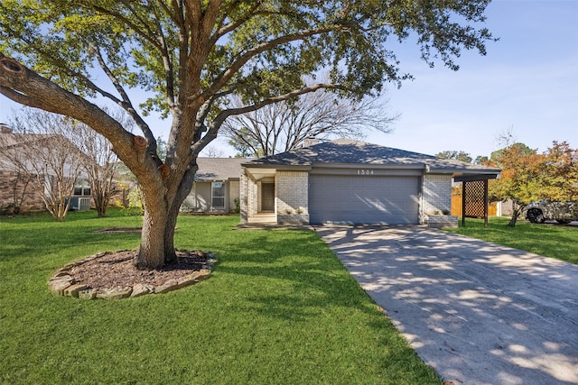 ranch-style home with a garage and a front lawn