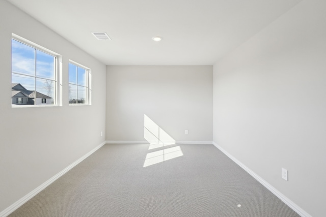 unfurnished room featuring carpet floors