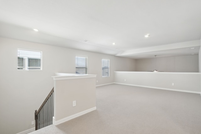 unfurnished room featuring light colored carpet