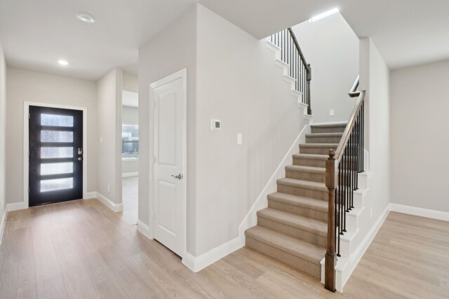 entryway with light hardwood / wood-style flooring