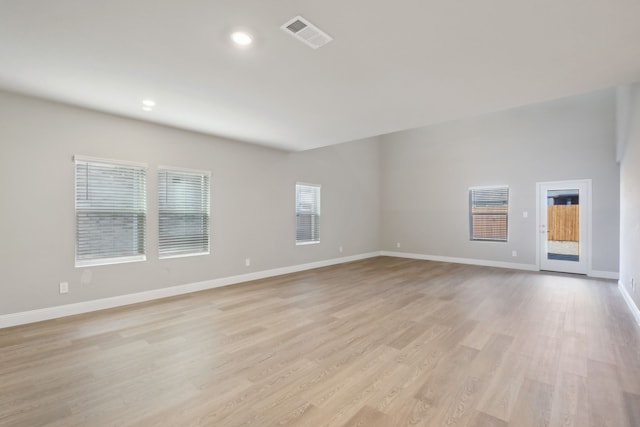 unfurnished room with light wood-type flooring