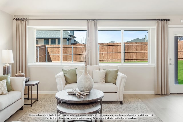 sitting room with hardwood / wood-style floors