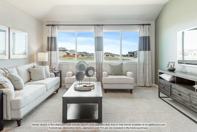 carpeted living room with lofted ceiling