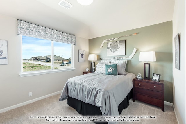 bedroom with light colored carpet