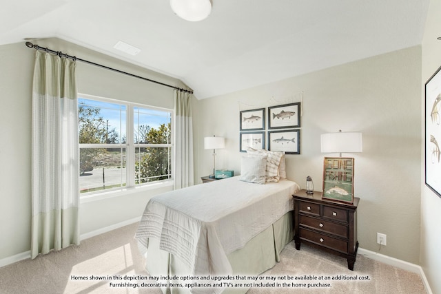 bedroom featuring lofted ceiling and light carpet