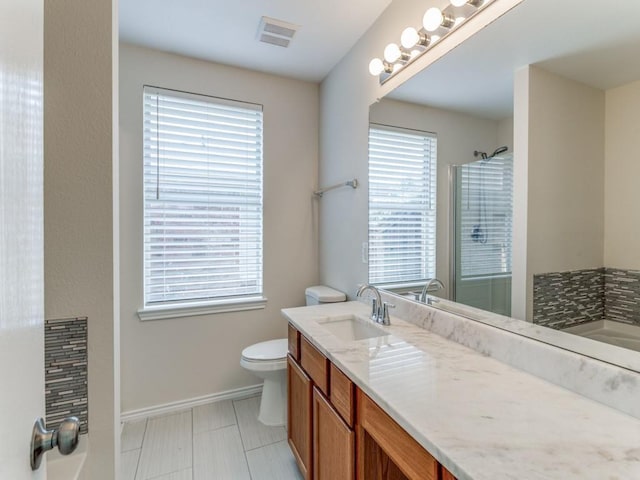 full bathroom featuring separate shower and tub, tile patterned flooring, vanity, and toilet