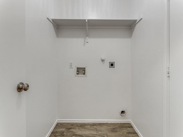 laundry room featuring electric dryer hookup, hookup for a gas dryer, hookup for a washing machine, and hardwood / wood-style floors