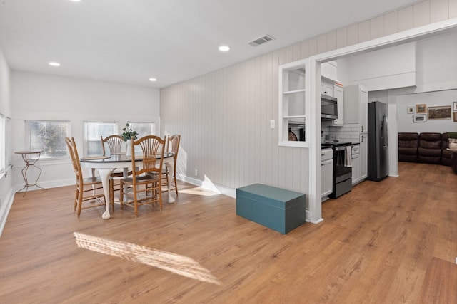 dining area with light hardwood / wood-style flooring