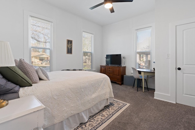 bedroom featuring dark carpet and ceiling fan