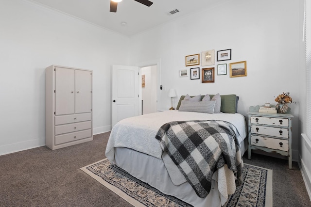 carpeted bedroom featuring ceiling fan, ornamental molding, and a high ceiling