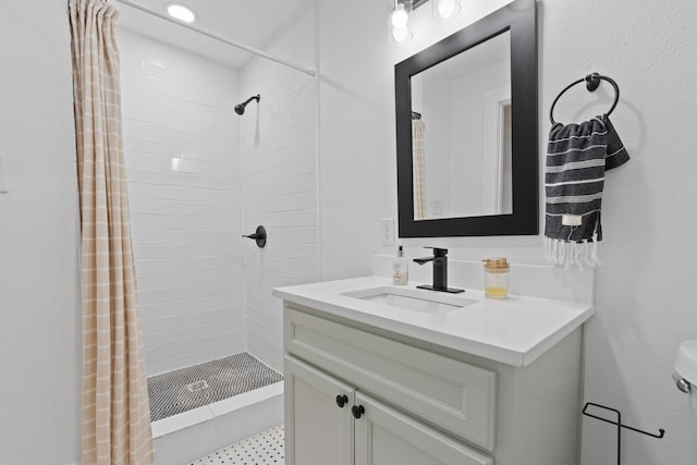 bathroom featuring vanity, toilet, and curtained shower