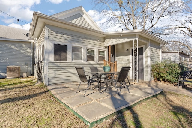 rear view of property featuring a patio