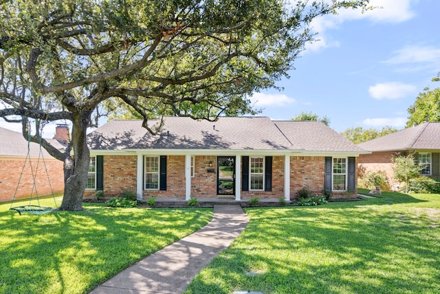 single story home featuring a front lawn